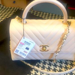Chanel Coco handle flap bag.